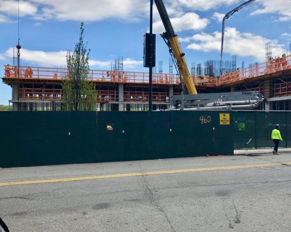 Today: Is Main Street moving in the right - or any - direction? Construction workers scurry as concrete lifts Southtown Building 8 above its protective fencing.